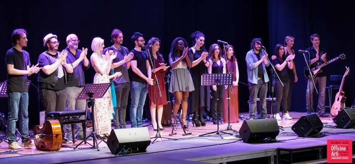 performers revieving applause while on stage