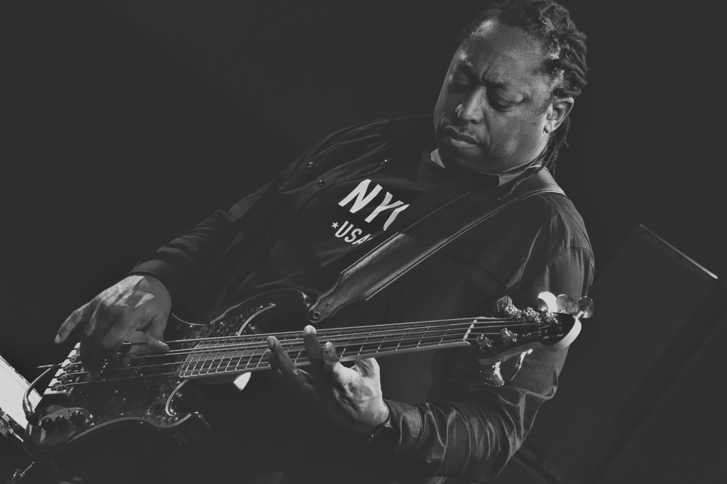 Monochrome view of Darryl Jones playing the Guitar