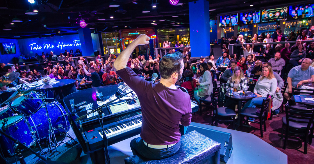 View of the crowd at the Piano Bar while someone performs
