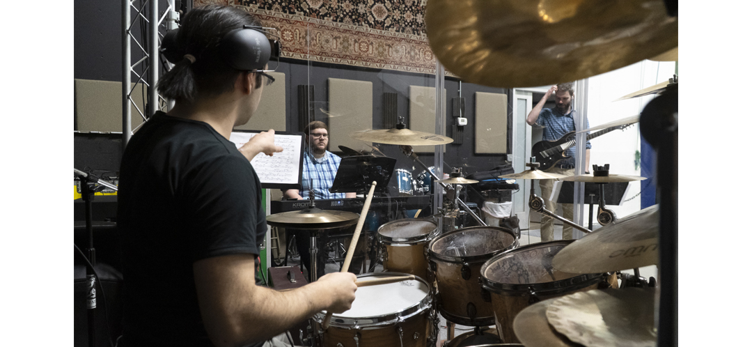Band in a studio recording music