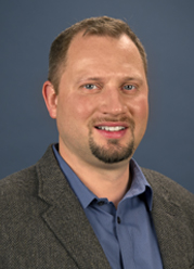Headshot of TJ Adams