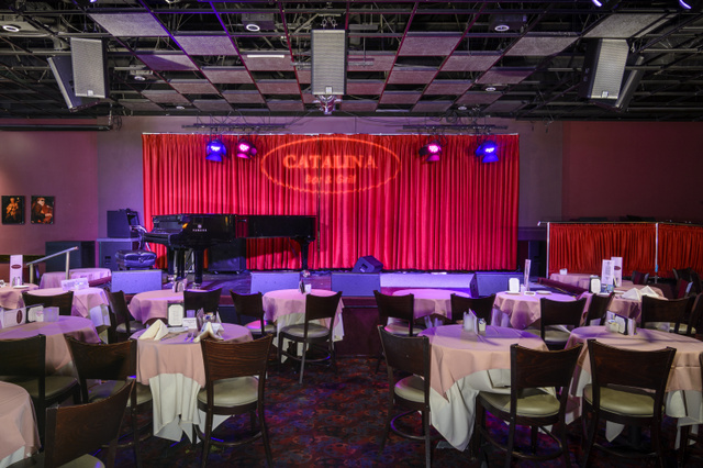 view of the stage and dining tables at the Catalina Jazz Club" height