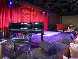 View of the piano on the stage at the Catalina Jazz Club