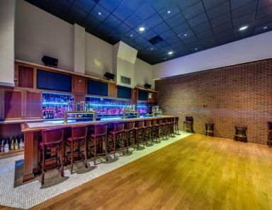 View of Nevada Smith's bar with mounted QSC speakers above