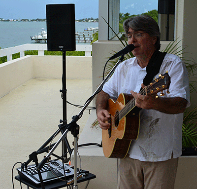 Bob Bonnen Performing live with a guitar and QSC TouchMix-16