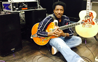 Doc Powell with a guitar