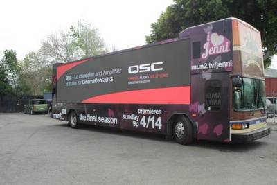 QSC Advertisement on the side of a tour-bus