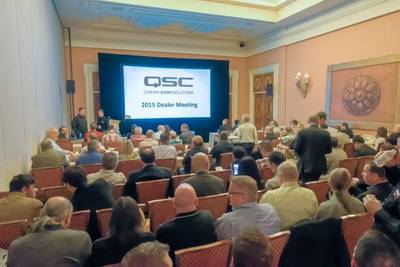 Crown gather to watch the QSC Cinema Dealer Meeting