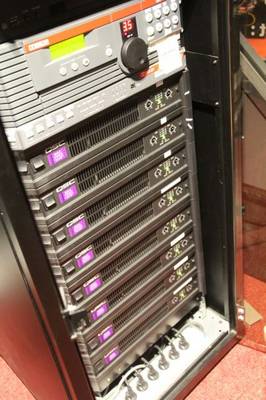 Cinema AV rack featuring QSC Amplifiers