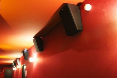 QSC Cinema Speakers mounted along the walls