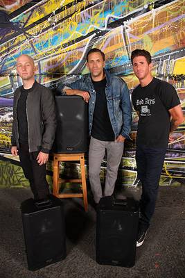 Members of Rock to Recovery is a non-profit posing with QSC Loudspeakers